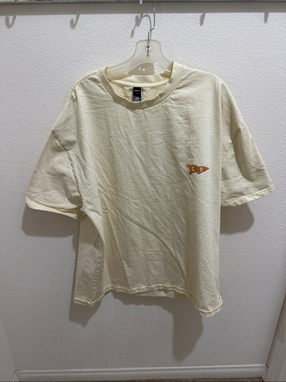 Men's Cream Short-Sleeve Graphic Tee with Small Chest Emblem